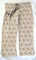 Women's beige pajama pants with a repeated pattern of sandpiper birds.